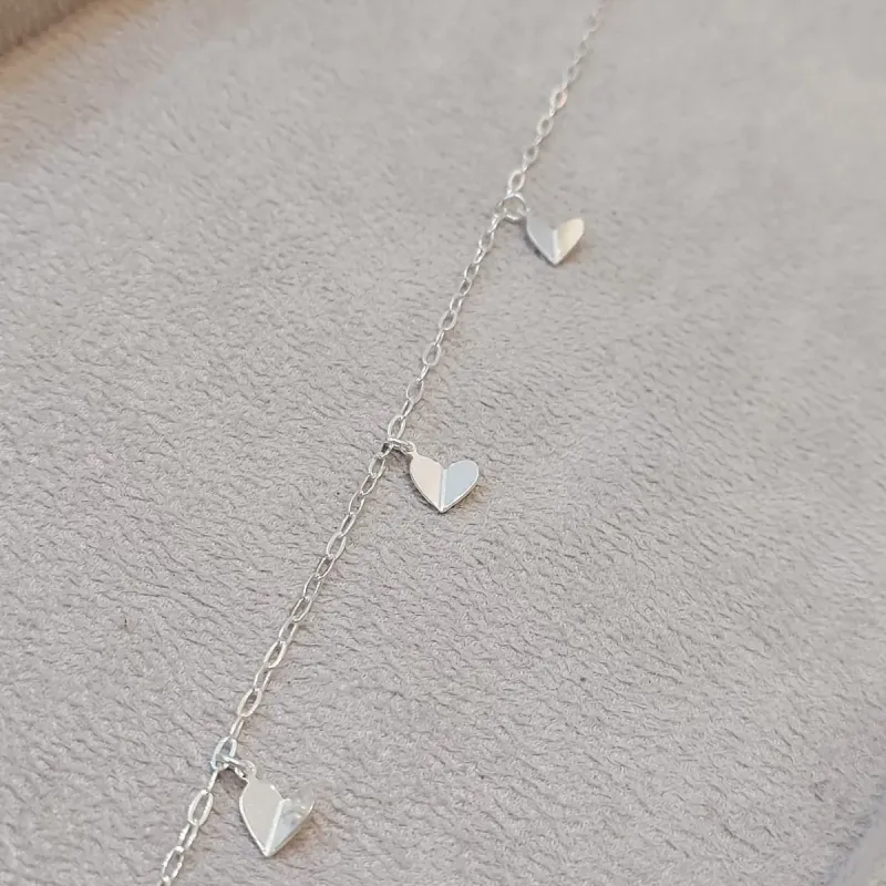 PULSEIRA PRATA ELOS E CORAÇÕES DOBRADOS