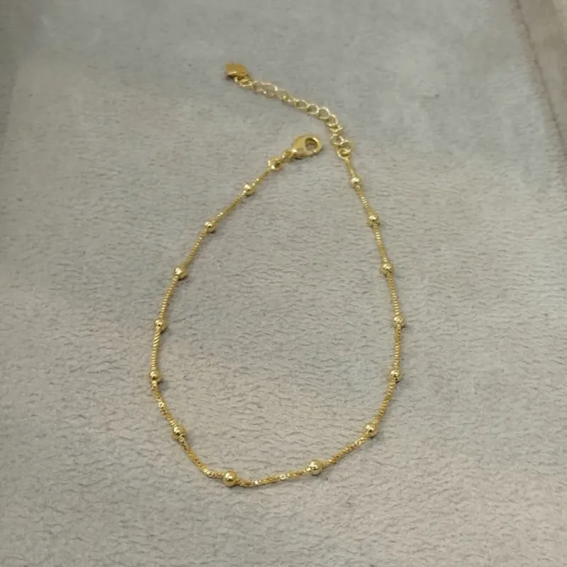 TORNOZELEIRA VENEZIANA E BOLINHAS