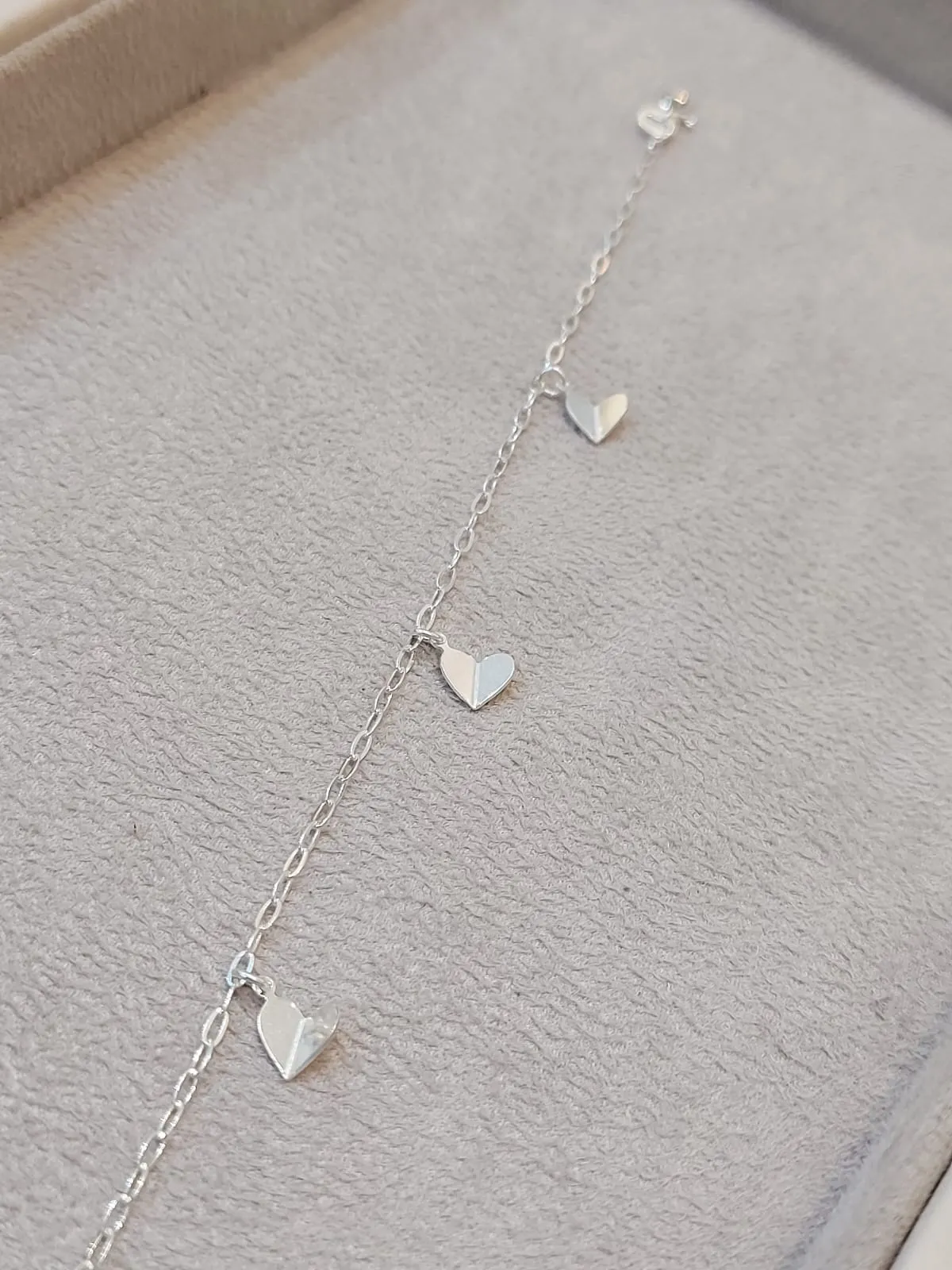 PULSEIRA PRATA ELOS E CORAÇÕES DOBRADOS