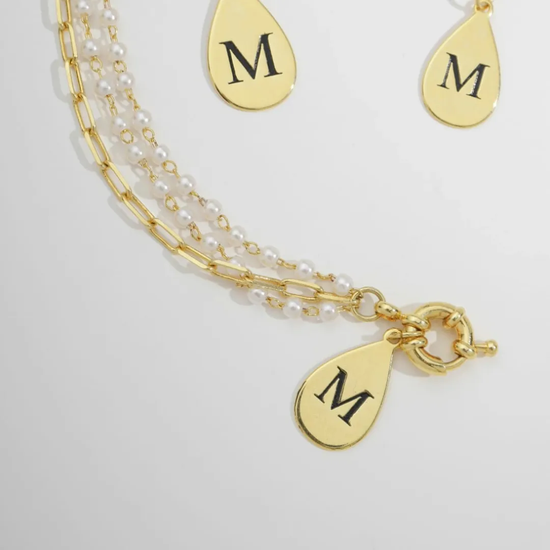 PULSEIRA COM PÉROLAS, INICIAL E FECHO BOIA